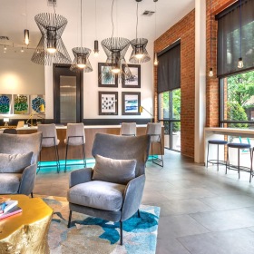Clubhouse spacious lounge with seating, modern decor, and easy access to the street