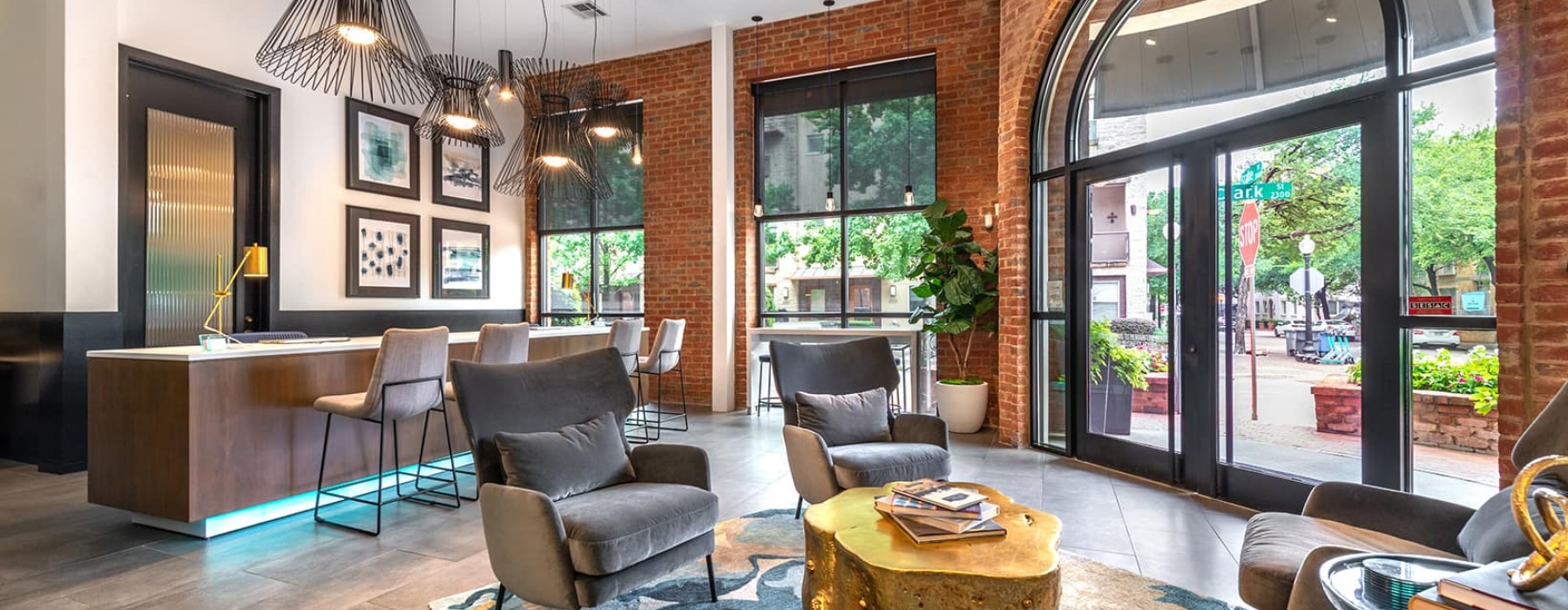 spacious lounge with seating, modern decor, and easy access to the street