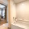 bathroom with a large tub