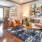 living area with large open spaces and lots of natural lighting through tall windows
