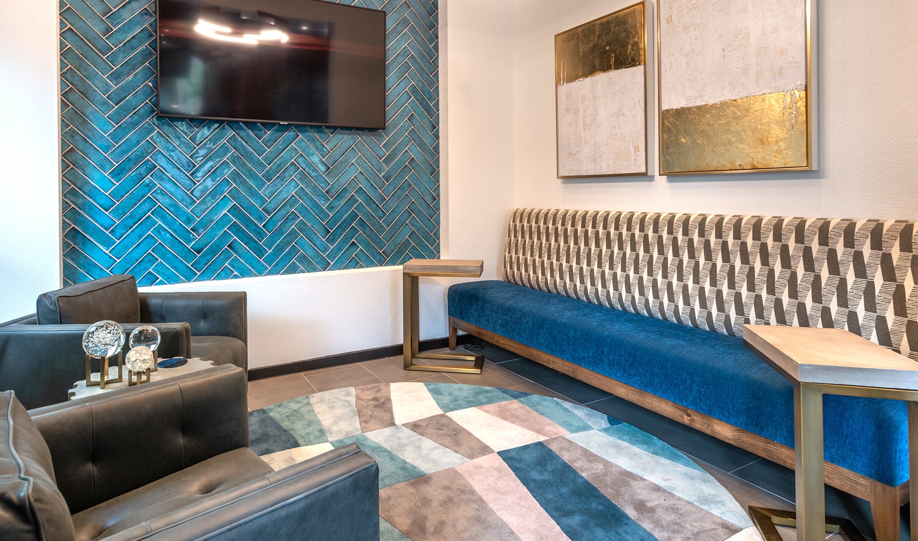 Uptown Refined interior of lounge showing TV, a couch and ample room for relaxing